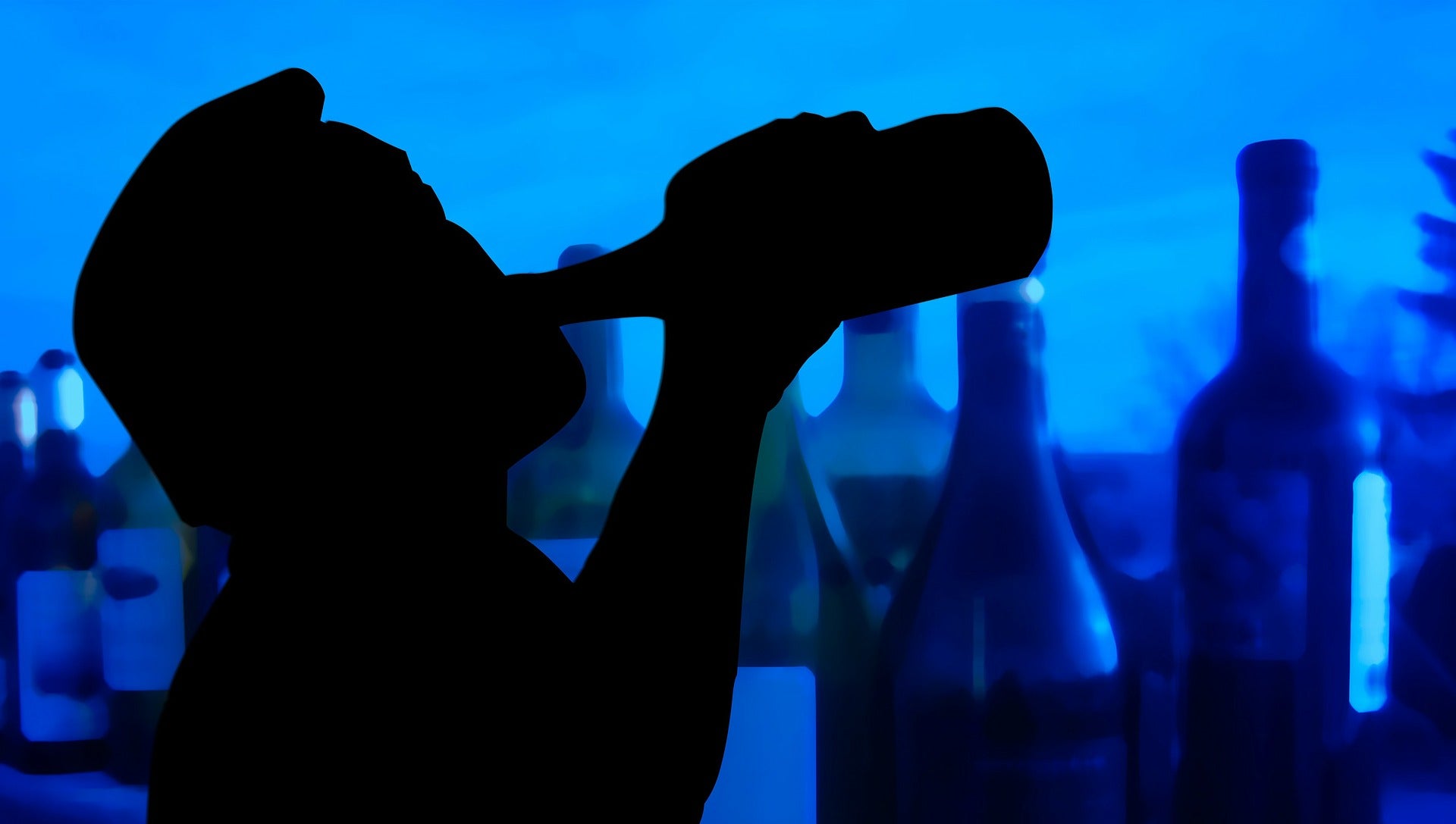 Silhouete of Man Drinking Bottle